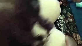 A brunette babe clamps her nipples in close-up detail.