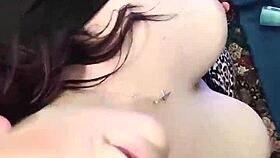 A brunette babe clamps her nipples in close-up detail.