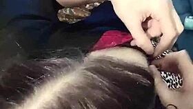 A brunette babe clamps her nipples in close-up detail.