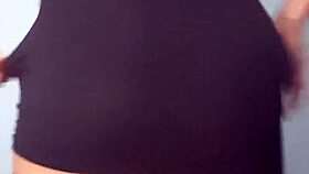 young girl dancing in mini dress with plug teasing her ass