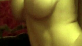 Amateur sexy blonde MILF with big tits fingers her wet pussy deeply.