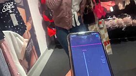 I feel the remote toy buzzing in my pussy at the shopping center, leading to an intense orgasm outdoors.