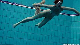 floating babe skinny-dipping in pool naked