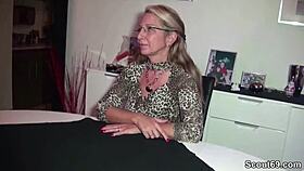 German milf with big natural tits and stockings fucks young guy passionately.