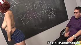 Redhead babe gives footjob in classroom