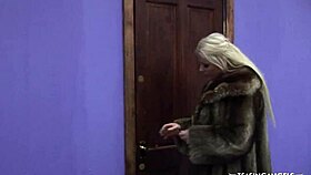 Gorgeous milf in stockings bends over for a suggestive blowjob in the bedroom