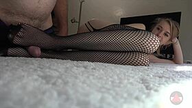 Skinny girl in fishnets and pantyhose performs footjob and handjob leading to cumshot.