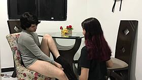 Stepsister receives treat in mouth after homemade fun in Spanish.