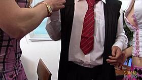 Two girls engage in a classroom activity with their teacher