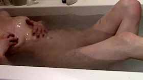 cute skinny blonde enjoys a relaxing bath