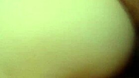 A Latina woman grabs her panties in a playful moment.