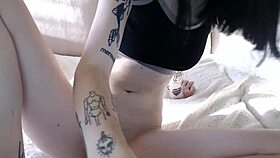 Horny tattooed white teen 18+ masturbates. She rubs her wet pussy hard.