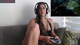 sexy latina plays video game while fingering her petite pussy