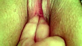 She's fingering her wet pussy during an intense masturbation session