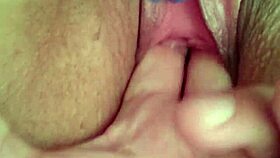 She's fingering her wet pussy during an intense masturbation session