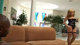 blonde woman and black man in bondage scene with sadism elements