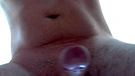 Man jerks off and shoots cum close up.