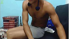 A cute guy chats on webcam with viewers