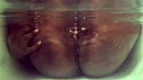 Tattooed Indian slut teases with boobs and cunt underwater in bathtub