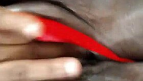 Can you believe this ebony milf teasing her shaved pussy with a dildo?