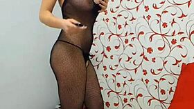 sophie is on webcam again, showing off her see-through fishnets and cute brunette look