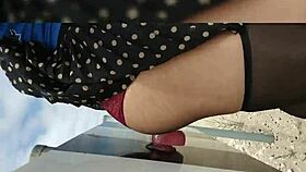 Babe fucks dildo in public construction area wearing stockings and heels