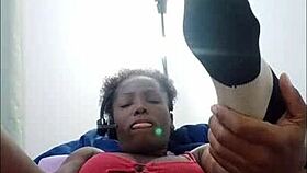 Watch this freaky ebony brunette shake her big ass while fucking pussy with dildo in socks