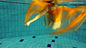 nastya strips down and shows her naked body in the pool