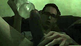 Intense gay play with toy in bold action.