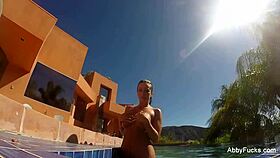 This photo shows Abigail enjoying sun by the pool in a great bikini body