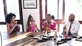 Passionate Black Couple In Sensual Lingerie And Sheer Red At Santa Caliente Event, Feeling Glamour And Beauty.