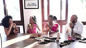 Passionate Black Couple In Sensual Lingerie And Sheer Red At Santa Caliente Event, Feeling Glamour And Beauty.