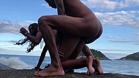 young couple gets intimate on the beach