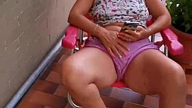 My Latina neighbor bends over on the balcony during the day, taking it in her big ass and pussy for a creampie.
