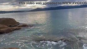 Shibari bondage performed in public with small tits exposed.