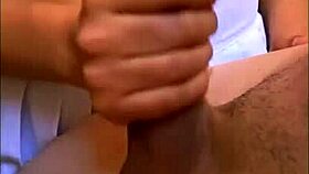 The tender childhood friend visits the young millionaire in his apartment and consoles him with affection after a hard day at the office.