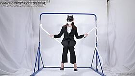 A woman engages in self-pleasure with a rope.