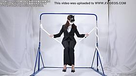 A woman engages in self-pleasure with a rope.