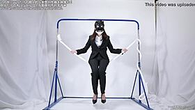 A woman engages in self-pleasure with a rope.