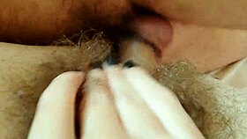 Hairy pussy takes hard fucking with cumshot close up. Amateur couple loves big clit action