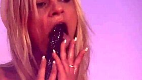 sexy blonde dances striptease on stage with ripped clothes