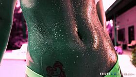 Peta Jensen's oiled body teases in hypnotic music video. Her big tits glisten wetly.