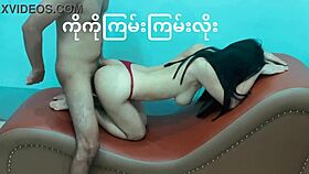 Asian woman relaxes on sofa in casual home setting