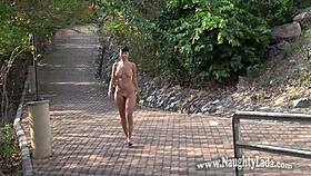 adventurous soul basks naked in public outdoor setting