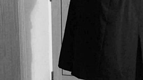 this crossdresser is tying himself up in uniform with handcuffs