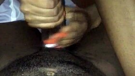 Giving him a handjob and footjob with big black cock