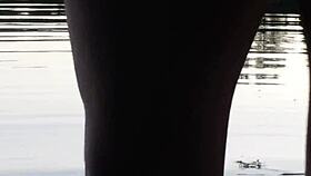 guy pissing in the lake outdoors