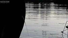 guy pissing in the lake outdoors