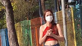 Asking directions from a woman at the bus stop