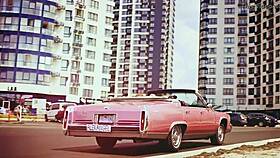 Alex Angel Dances Erotically, Strips, and Kisses in Tattooed Passion. City of Love Sets the Scene